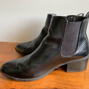 Black slip on ankle boots.